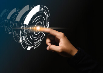 Businessman presses finger on the center and shows a concept of technology hologram.