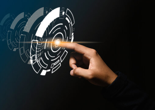 Businessman presses finger on the center and shows a concept of technology hologram.
