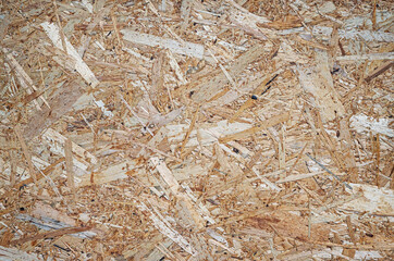  Background of wood chips. Pressed wood chip board texture.