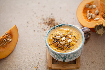 Fototapeta na wymiar Delicious composition with pumpkin soup, top view.
