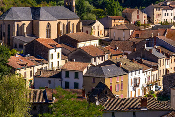 Beautiful top view of the French village of Laguepie. Old catholic cathedral. Orange tiled roofs. 