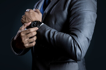 Businessman checking time on watch