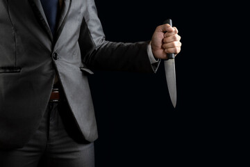 businessman holding knife for blackmail concept.