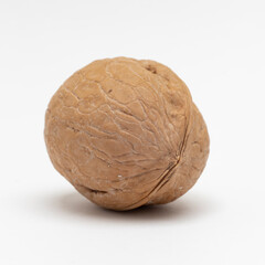 Walnut in a shell.close-up on a white background.