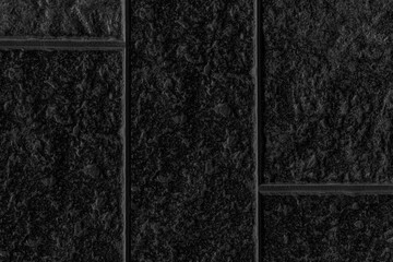 Black granite block wall pattern and background seamless