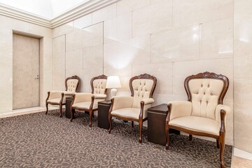 White leather chair empty At the lobby area in a luxury hotel