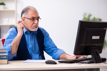 Old male author writing books