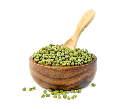 green mung beans with bowl and wooden spoon isolated on white background