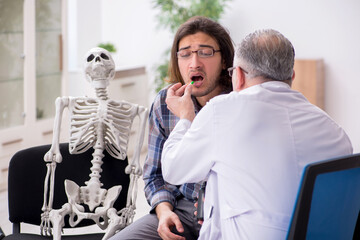 Young male patient visiting experienced doctor psychiatrist