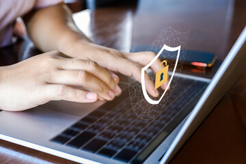 Businesswoman hand using laptop with Data protection, Cyber security secure, information safety and encryption concept. internet technology concept. © RoBird