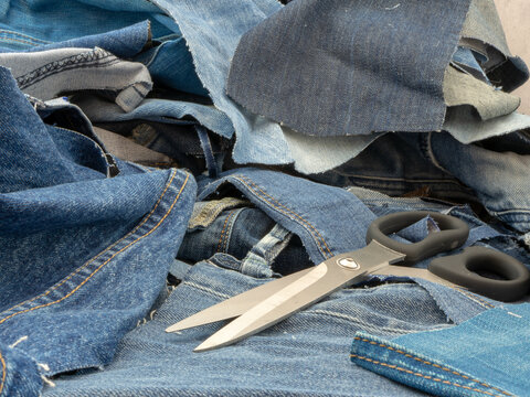 A pile of old blue jeans ready to be recycled in the circular economy. 