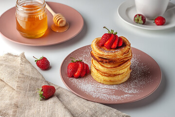 Delicious, only baked pancakes with fresh aromatic strawberries