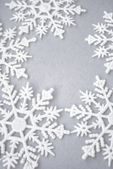 Winter gray background with snowflakes. New Year 2021. Christmas background.
