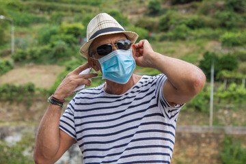 man with medical mask using medical phone