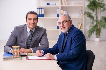 Two businessmen in time management concept