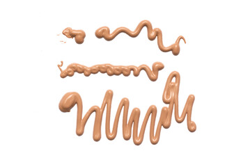 Foundation cream smear isolated on the white background.