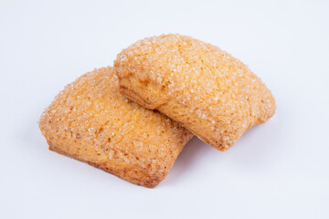 fresh sweet cookies, sprinkled with sugar, isolated on a white background