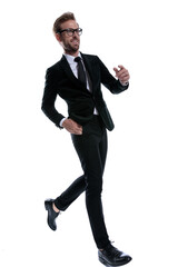 smiling elegant man in black suit marching