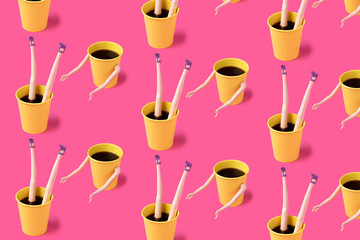 Pattern made of coffee cups with female doll hands and legs on pink background. Minimal coffee...