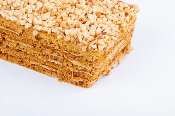 fresh pastry with filling, sprinkled with nuts, isolated on a white background