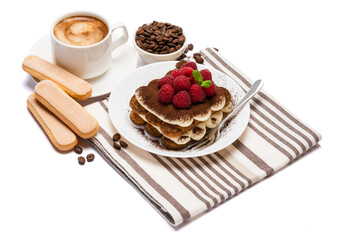 portion of Classic tiramisu dessert with raspberries and cup of fresh hot espresso isolated on white background - clipping path