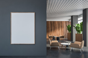 Gray and wooden office lounge with poster