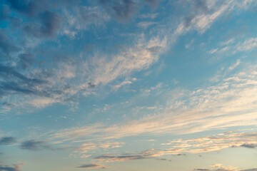 Fototapeta premium Blue sky with clouds before sunset, abstract natural background