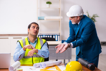 Two male architects working in the office