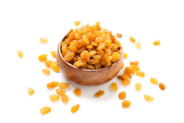 Golden dried raisins in wooden bowl isolated on white background