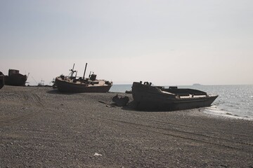 old fishing boats on the shore