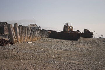 old fishing boats on the shore