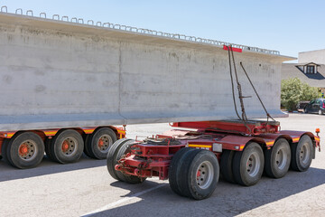 Special transport with a beam. Specific platform for transporting beams or other elements of large dimensions and weights.