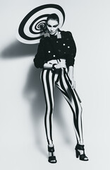 hot woman in striped leggings with umbrella