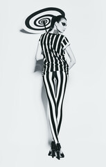 hot woman in striped top and leggings with spiral umbrella