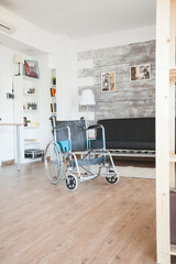 Hospital wheelchair empty room for transportation of patient with mobility handicap. No patient in...