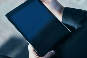 Manager with a tablet in hands outdoors technology communication