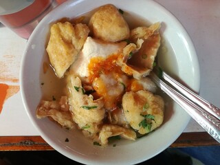 Fried tofu with tasty soup called cuanki, traditional food from Bandung