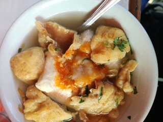 Fried tofu with tasty soup called cuanki, traditional food from Bandung