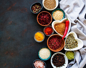 Various spices in a bowls on a black