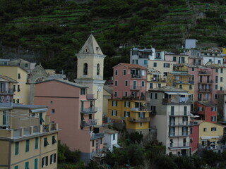 Cinque Terre, Italy - 08/31/2020: Beautiful landscape of a coastal fishing village, amazing view on many little colorful houses, traditional architecture of the little Italian town called Cinque Terre