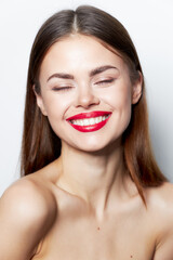 Obraz premium Woman bare shoulders Smile red lips closed eyes 