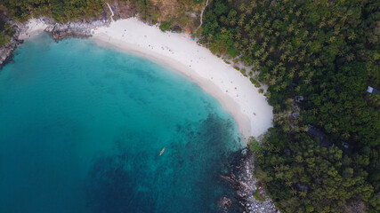 Aerial view. Top view of tropical island forest and white sand beach with turquoise sea water in Phuket, Thailand. Freedom beach.