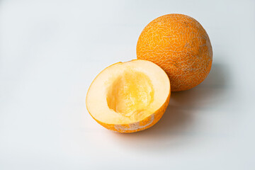 Raw organic half melon on a wooden board. Summer fruit concept