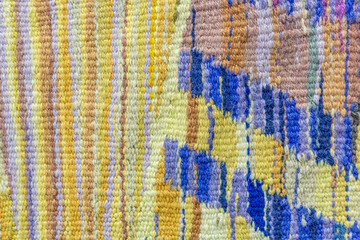 Natural wool carpet with abstract textured knitted elements