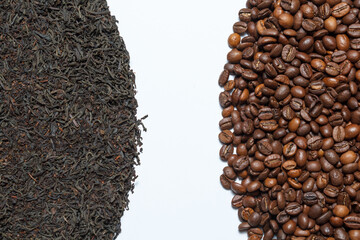Black tea leaves and roasted coffee beans on a white background.
