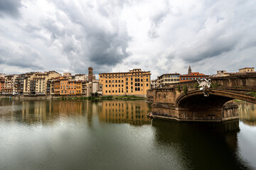 Fototapeta na wymiar Florence cityscape, Santa Trinita Bridge (XVI century) and the River Arno, UNESCO world heritage site. Tuscany, Italy, Europe