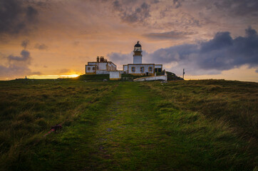 Fototapeta na wymiar Neist Point Lighthouse at sunset, Isle of Skye, Scotland