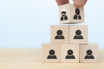 business hand man put arranging on wooden cube block that family or company Succession business concept from old generation to next generation.