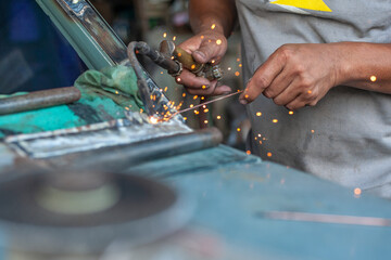 Car body worker welding car body - 376200295