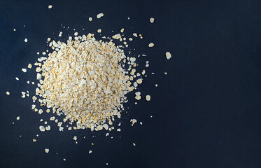 pile of oatmeal isolated on black background